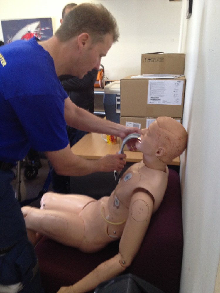 Karel showing how they do awake laryngoscopy on sitting patient with VL